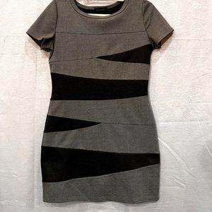 Grey and black, knit, body con, mini length dress.